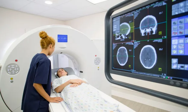 CT Technologist Scanning Female Patient in Hospital - MTMI