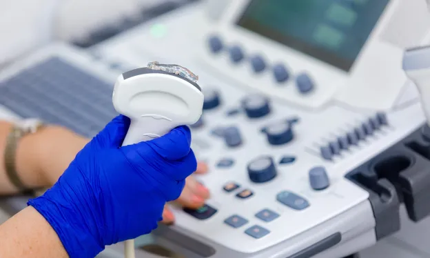 Close Up of Ultrasound Technologist with Equipment - MTMI