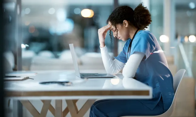 nurse struggling with emotional burnout