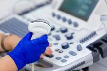 Close Up of Ultrasound Technologist with Equipment - MTMI